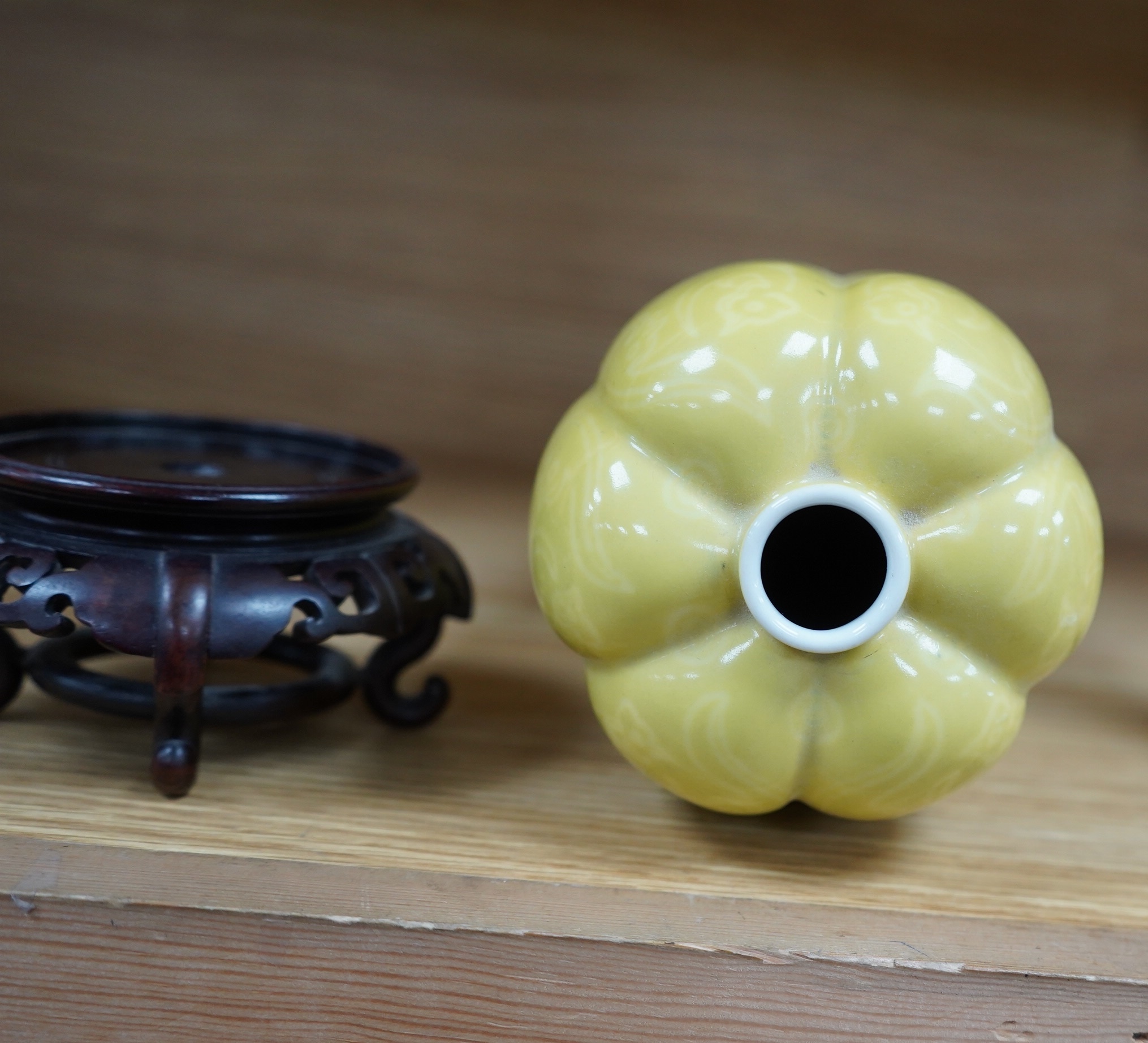 A Makuzu Kozan yellow ground vase, early 20th century, drilled hole to the base, raised on hardwood stand, 29cm high overall. Condition - fair